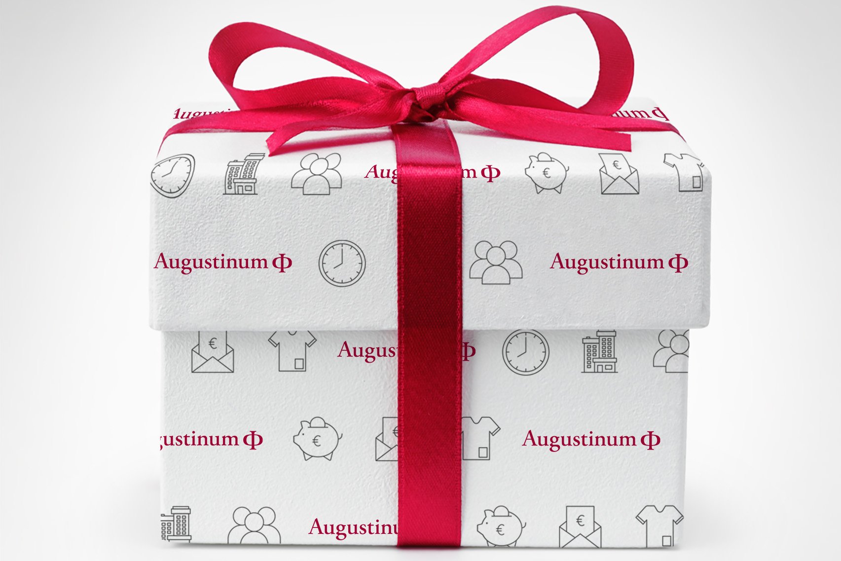 Als Geschenk verpackt Schachtel mit Augustinum-Aufdruck und einer roten Schleife