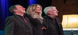 Drei Musiker auf der Bühne